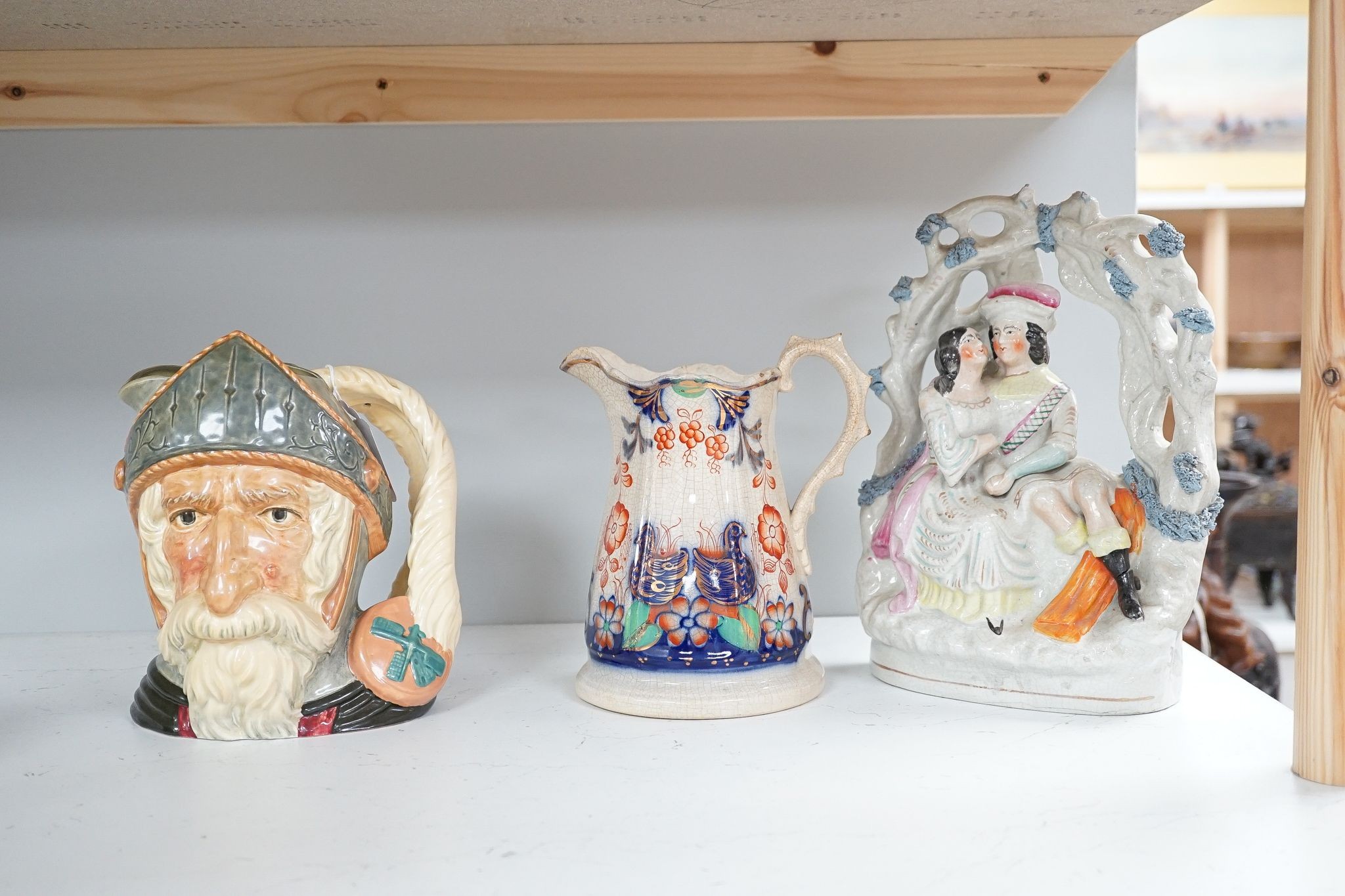 A Royal Doulton character jug and 6 other pieces including a Staffordshire figure group, tallest 25cm